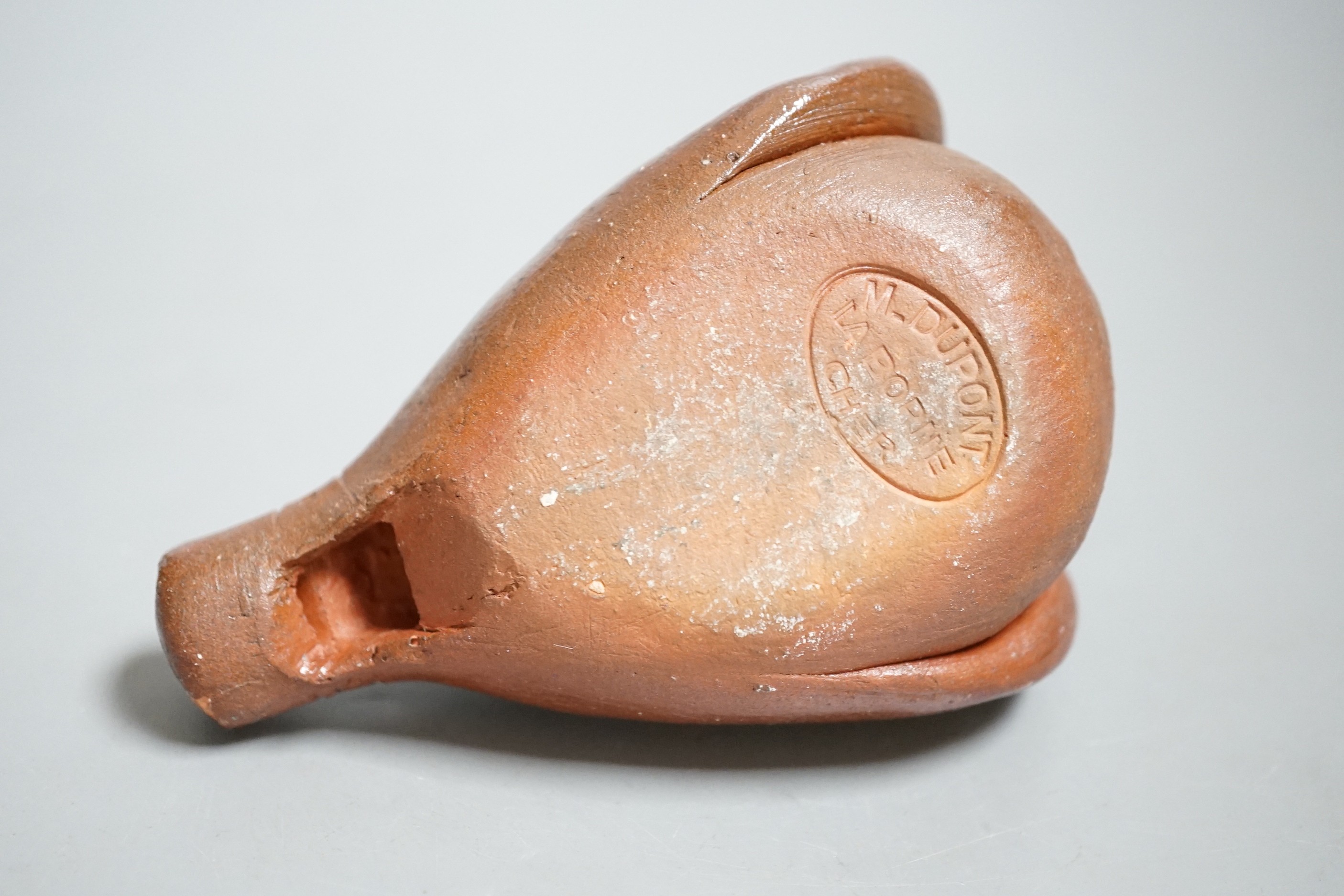 A French pottery novelty whistle modelled as a rooster, stamped M-DUPONT LA BORNE CHER. 12.5cm long